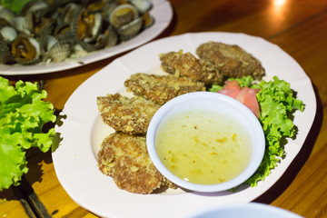 sweet plum sauce on deep fried shrimp and white dish