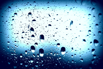 Raindrops on the window. Close-up of water on the glass. After the rain.