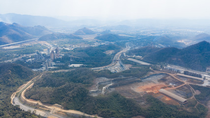 Aerial view of cement factory between the mountain.
