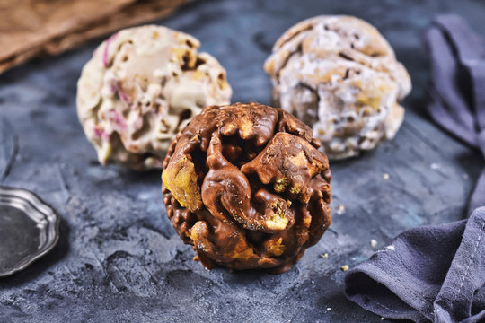 Different flavors of ball shaped traditional German sweet food called 'Schneeballen', meaning 'Snowball', made from shortcrust pastry, a speciality from tourist city Rothenburg 