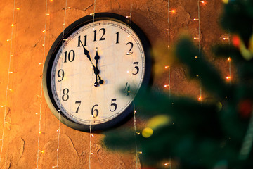 Obraz na płótnie Canvas Countdown to midnight. Retro style clock counting last moments before Christmas or New Year - Image