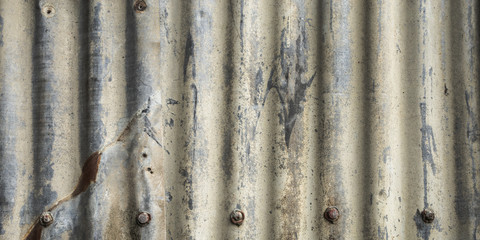 Abstract background grunge metal corrugated iron with scratches and rust. Rough textured old weathered rustic backdrop