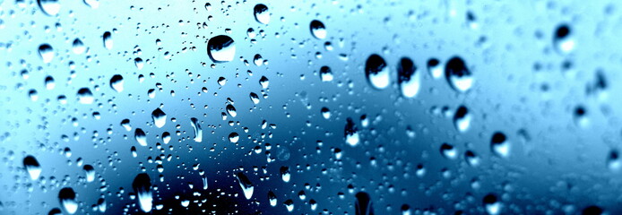 Raindrops on the window. Close-up of water on the glass. After the rain.