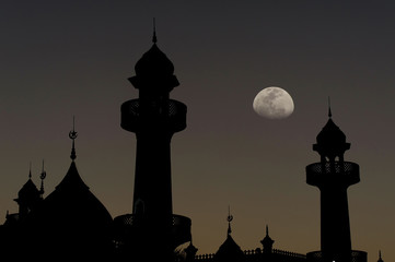 silhouette of muslim mosque dome with half moon on twilight background.concept for ramadan and prayer time background