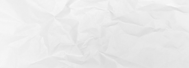 Crumpled paper background of white colour. View from above. Old office paper. 