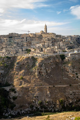 Panoramic view of Sassi di Matera a historic district in the city of Matera, well-known for their ancient cave dwellings from the Belvedere di Murgia Timone,  Basilicata, Italy