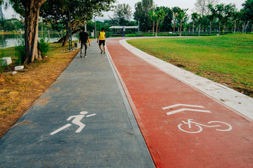 Two man jogging on tracks at a Public Park 