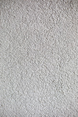 Gray plaster, building insulation on foamed polystyrene, background, texture.