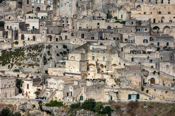 Panoramic view of Sassi di Matera a historic district in the city of Matera, well-known for their ancient cave dwellings from the Belvedere di Murgia Timone,  Basilicata, Italy