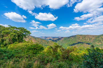 beautiful blue sky high peak mountains mist fog wildlife green forest at khao yai national park, Nakhon Ratchasima, Saraburi, Thailand guiding idea long weekend for backpacker camping campfire hiking
