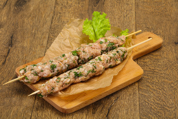 Raw minced pork skewer kebab for grill
