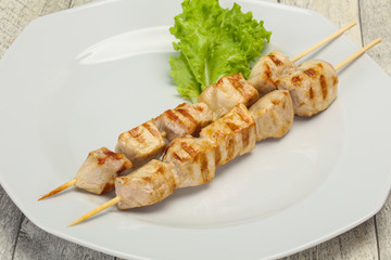 Grilled pork skewer served salad