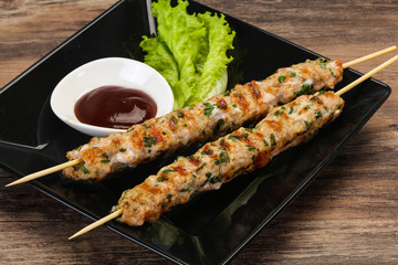 Minced pork skewer kebab with sauce