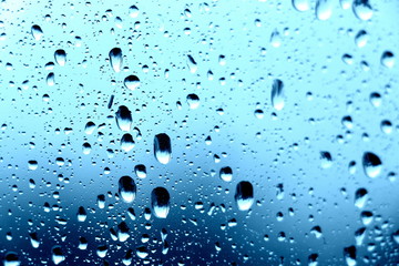 Raindrops on the window. Close-up of water on the glass. After the rain.