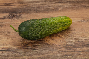 Green ripe fresh cucumber over background
