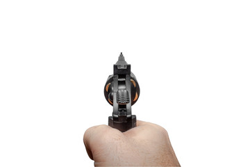 A man's hand with a loaded black revolver aims forward. First-person view.