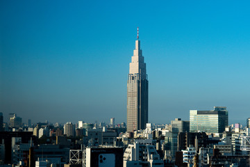Japan / Tokyo - October 30 2019:  NTT DOCOMO Yoyogi Building with sky in the morning. Japan city urbanscape real estate.