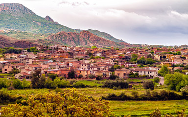 Extensive rural landscape with meadows, hedges and orchard (Ogliastra region, east Sardinia, Italy)) during stormy weather.