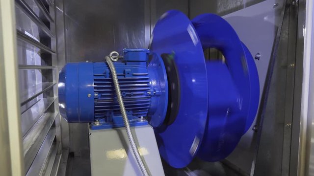 Big fan is working in a professional air conditioning and heating system for office buildings and malls. Ventilation equipment for industry and business