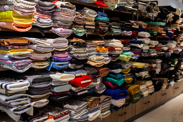 Rolls of fabric in stock. Interior of a industrial warehouse with fabric rolls. colorful fabric rolls on textile market
