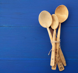set of wooden vintage spoons tied with brown rope