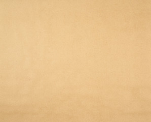 texture of smooth brown kraft wrapping paper, full frame