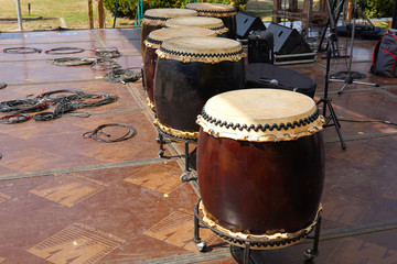 A big Taiko drum o-daiko on isolated red background. Musical percussion instrument of Asia