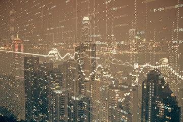 Double exposure of forex chart drawings over cityscape background. Concept of success.