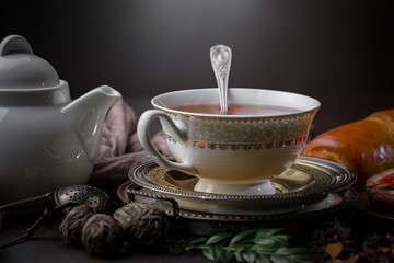 Tea hot drink on old background in composition on the table