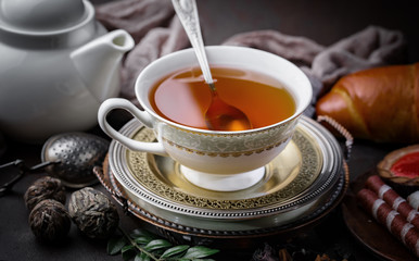 Tea hot drink on old background in composition on the table