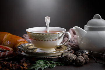 Tea hot drink on old background in composition on the table