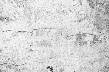 Texture of a concrete wall with cracks and scratches which can be used as a background