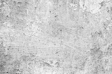 Texture of a concrete wall with cracks and scratches which can be used as a background