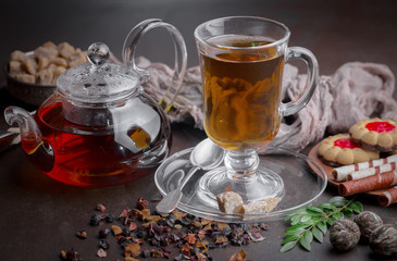 Tea hot drink on old background in composition on the table