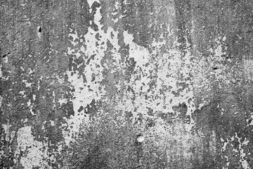 Texture of a concrete wall with cracks and scratches which can be used as a background