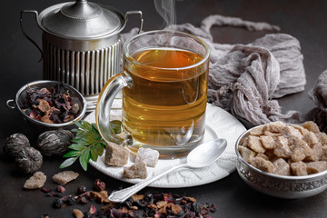 Tea hot drink on old background in composition on the table