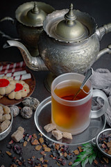 Tea hot drink on old background in composition on the table