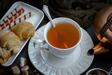 Tea hot drink on old background in composition on the table