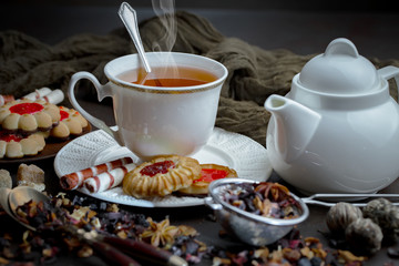 Tea hot drink on old background in composition on the table