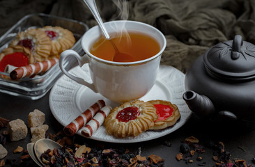 Tea hot drink on old background in composition on the table