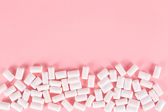 White Bubble Gum Pills On Pink Background