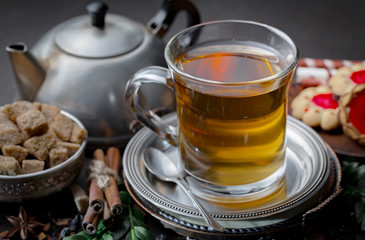 Tea hot drink on old background in composition on the table