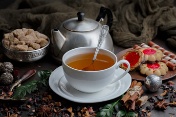 Tea hot drink on old background in composition on the table