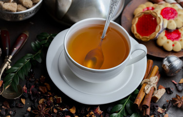 Tea hot drink on old background in composition on the table