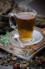 Tea hot drink on old background in composition on the table