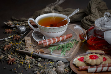 Tea hot drink on old background in composition on the table