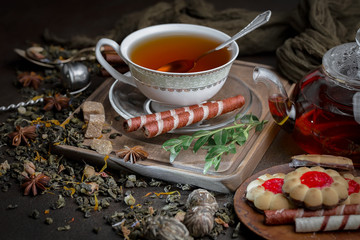 Tea hot drink on old background in composition on the table