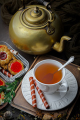 Tea hot drink on old background in composition on the table