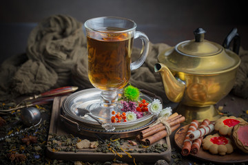 Tea hot drink on old background in composition on the table