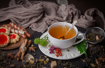 Tea hot drink on old background in composition on the table